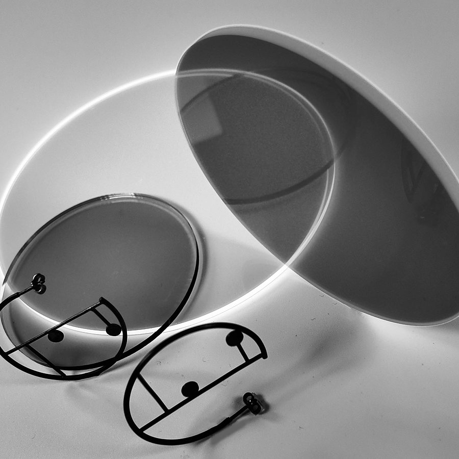 Pair of black wire hoop earrings with two dots, on acrylic discs
