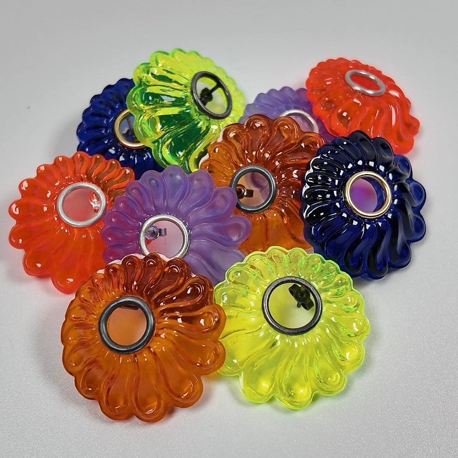 Colorful flower-shaped acrylic stud earrings in orange, green, purple and blue with metal rings