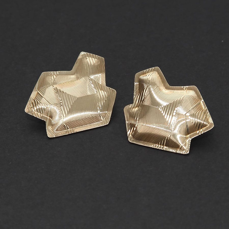 Pair of brass stud earrings with a faceted, folded shape and guilloché lines